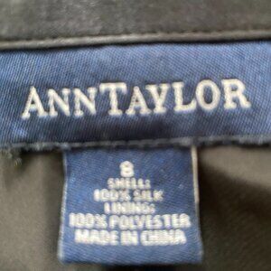 Ann Taylor black 100% silk 3/4 length skirt.